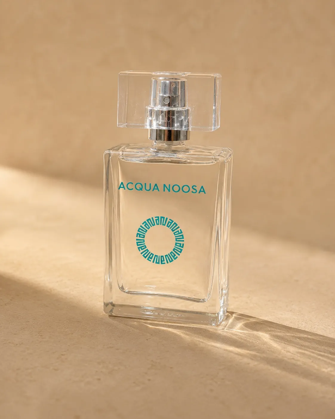 The Acqua Noosa 50ml eau de parfum bottle in warm afternoon light
